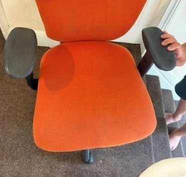 After: the orange office chair with an even, refreshed seat and back